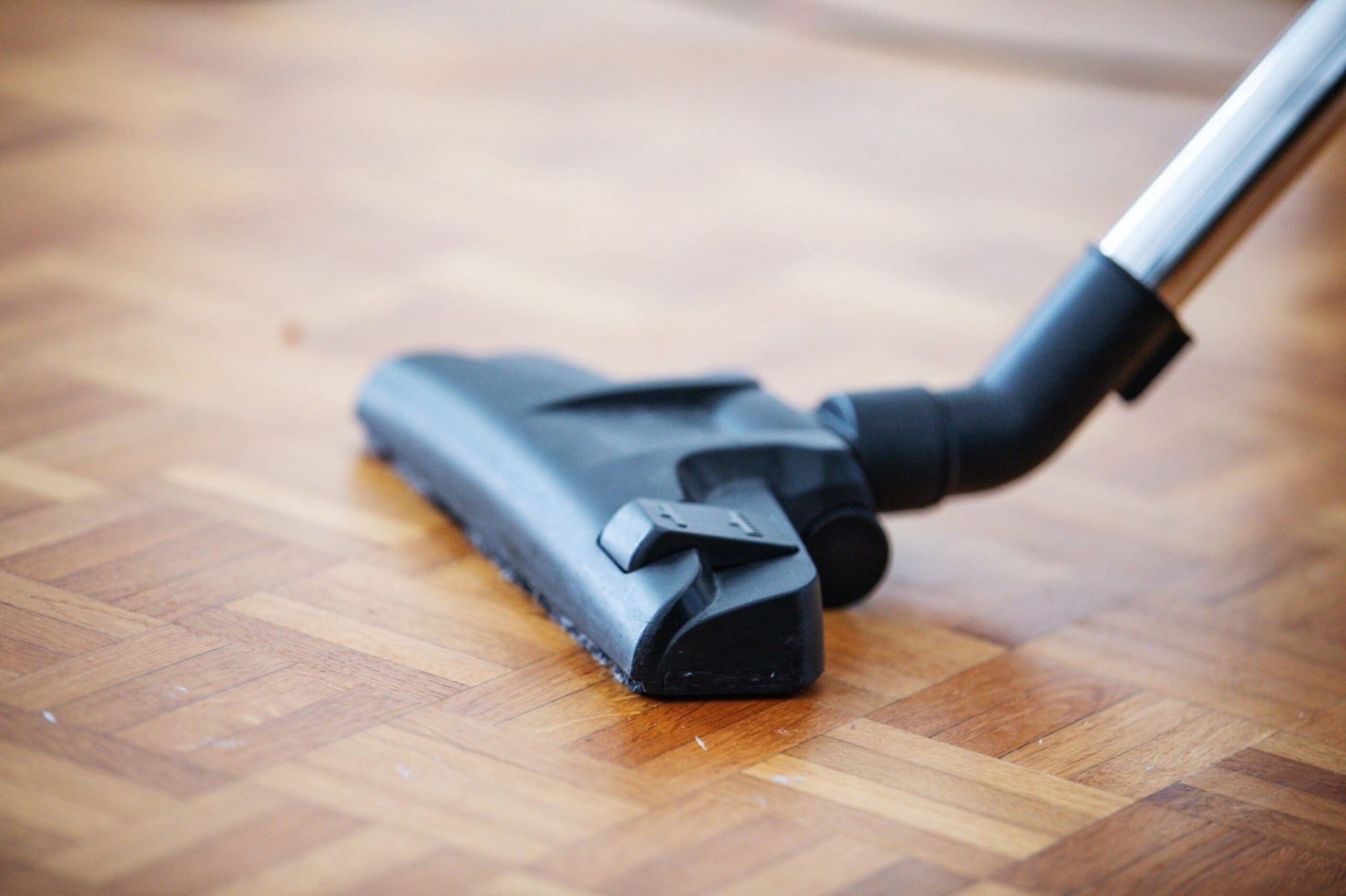 Vacuum cleaner used on wooden floor